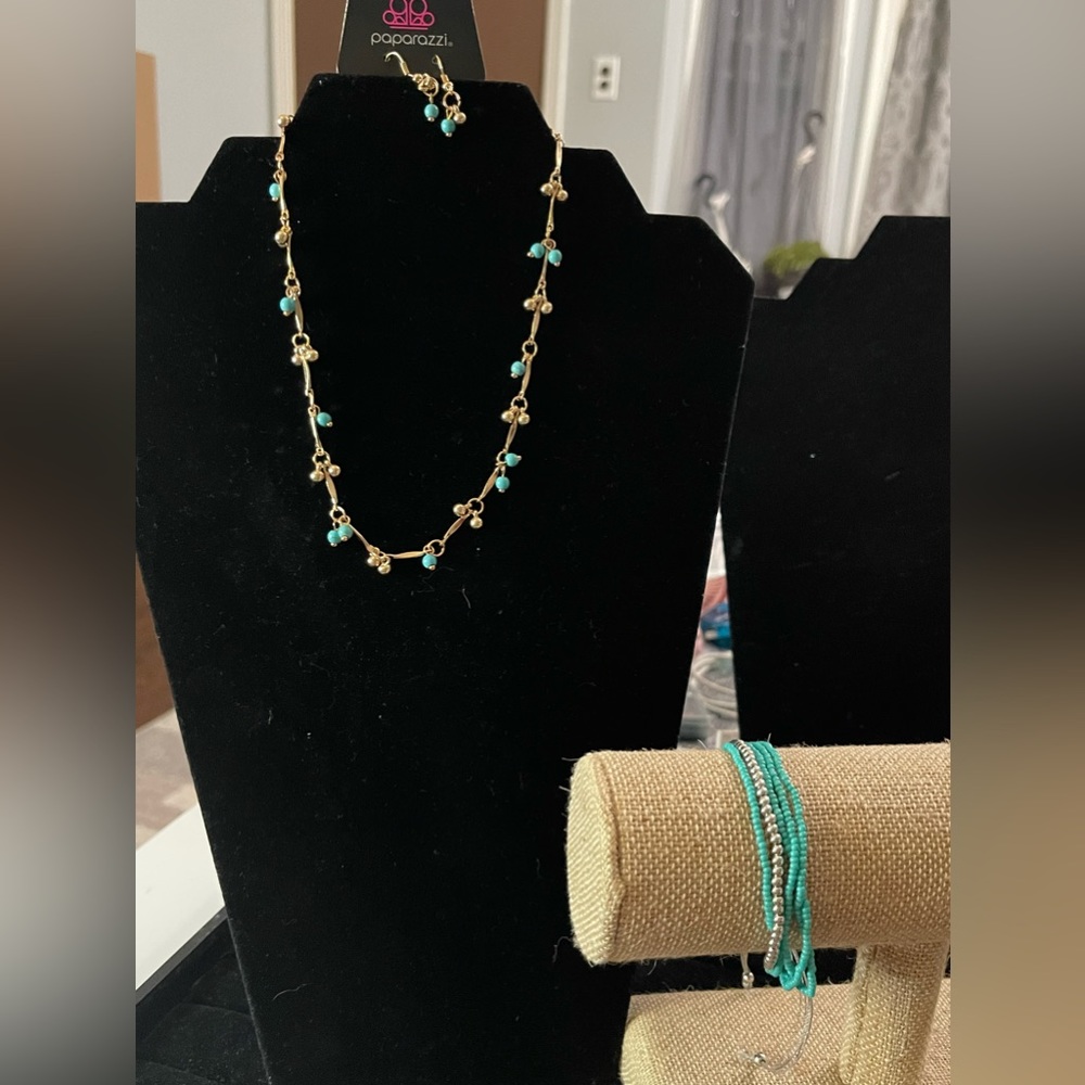 Gold and teal necklace and bracelet.